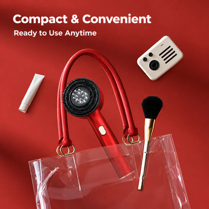 Compact red scalp massager brush floating above a clear travel bag with makeup items, ready to use anytime | ZEDSHOPPE®.